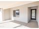 Modern entryway with black door and large window, showcasing natural light at 11252 N 37Th St, Phoenix, AZ 85028