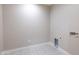 Simple laundry room with patterned tile floor and neutral walls at 11252 N 37Th St, Phoenix, AZ 85028