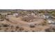 Aerial view of a new construction home with surrounding desert landscape at 125 Ironwood Pl, Wickenburg, AZ 85390