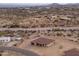 Aerial view of a new construction home on a desert lot at 125 Ironwood Pl, Wickenburg, AZ 85390