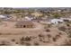 Aerial view of a new single-story home with desert landscaping at 125 Ironwood Pl, Wickenburg, AZ 85390