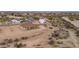 Aerial view of house and surrounding desert landscape at 125 Ironwood Pl, Wickenburg, AZ 85390