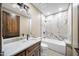 Modern bathroom with soaking tub, marble tile, and vanity at 125 Ironwood Pl, Wickenburg, AZ 85390