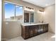 Bathroom with double vanity and large window at 125 Ironwood Pl, Wickenburg, AZ 85390