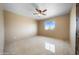 Well-lit bedroom with tile floors and ceiling fan at 125 Ironwood Pl, Wickenburg, AZ 85390