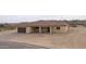 New construction home's front exterior with garage and covered entry at 125 Ironwood Pl, Wickenburg, AZ 85390