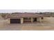 New construction home's front exterior with garage and covered entry at 125 Ironwood Pl, Wickenburg, AZ 85390