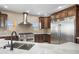 Kitchen with stainless steel appliances and custom cabinetry at 125 Ironwood Pl, Wickenburg, AZ 85390