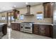 Kitchen with stainless steel appliances and custom cabinetry at 125 Ironwood Pl, Wickenburg, AZ 85390