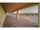 Covered patio with brick pavers and view of desert landscape at 125 Ironwood Pl, Wickenburg, AZ 85390