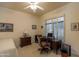 Guest bedroom with desk and window with plantation shutters at 11736 E Del Timbre Dr, Scottsdale, AZ 85259