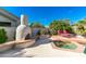 Outdoor patio with a hot tub and fire pit for relaxing evenings at 11736 E Del Timbre Dr, Scottsdale, AZ 85259