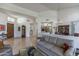 Open floor plan living room with hardwood floors and large windows at 11736 E Del Timbre Dr, Scottsdale, AZ 85259