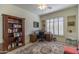 Home office with built-in shelving and window seating at 11736 E Del Timbre Dr, Scottsdale, AZ 85259