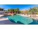 Inviting pool area with a waterfall, spa, and lounge chairs at 11736 E Del Timbre Dr, Scottsdale, AZ 85259