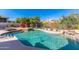 Relaxing pool area with a waterfall and ample lounge space at 11736 E Del Timbre Dr, Scottsdale, AZ 85259