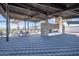 Outdoor entertainment area with fireplace and tables at 1223 W Sparrow Dr, Queen Creek, AZ 85140