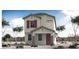 Two-story home with red door and landscaping at 1223 W Sparrow Dr, Queen Creek, AZ 85140