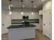 Modern kitchen featuring white cabinets and a large island at 1223 W Sparrow Dr, Queen Creek, AZ 85140