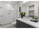 Modern bathroom with dark vanity and glass shower at 12331 E Gold Dust Ave, Scottsdale, AZ 85259