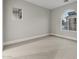 Bright bedroom with neutral carpeting and an arched window at 12331 E Gold Dust Ave, Scottsdale, AZ 85259