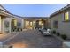 Inviting courtyard with brick pavers, seating area, and drought-tolerant landscaping at 12331 E Gold Dust Ave, Scottsdale, AZ 85259