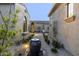 A tranquil courtyard pathway with fountain, lighting, and lush landscaping at 12331 E Gold Dust Ave, Scottsdale, AZ 85259