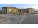 Luxury home showcasing a rock water feature and desert landscaping at 12331 E Gold Dust Ave, Scottsdale, AZ 85259