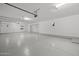 Spacious garage with epoxy flooring and overhead storage at 12331 E Gold Dust Ave, Scottsdale, AZ 85259