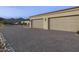 Three-car garage with light fixtures and herringbone driveway at 12331 E Gold Dust Ave, Scottsdale, AZ 85259