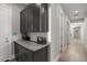 Clean hallway with dark wood cabinets and storage at 12331 E Gold Dust Ave, Scottsdale, AZ 85259