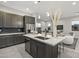 Modern kitchen with a large island and stainless steel appliances at 12331 E Gold Dust Ave, Scottsdale, AZ 85259