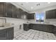 Bright laundry room featuring ample cabinetry and a window at 12331 E Gold Dust Ave, Scottsdale, AZ 85259