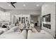 Modern living room with fireplace and plenty of natural light at 12331 E Gold Dust Ave, Scottsdale, AZ 85259