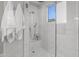 Spacious walk-in shower with marble tile and built-in bench at 12331 E Gold Dust Ave, Scottsdale, AZ 85259