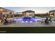 Stunning pool and spa area with a pergola and lounge chairs at 12331 E Gold Dust Ave, Scottsdale, AZ 85259