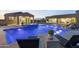 Expansive pool and spa with a fire pit and lounge chairs at 12331 E Gold Dust Ave, Scottsdale, AZ 85259