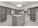 Spacious walk-in closet with ample shelving and drawers at 12331 E Gold Dust Ave, Scottsdale, AZ 85259