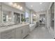 Luxurious bathroom with soaking tub, double vanity, and natural light at 12347 E Gold Dust Ave, Scottsdale, AZ 85259