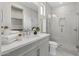 Modern bathroom with gray vanity and glass shower at 12347 E Gold Dust Ave, Scottsdale, AZ 85259