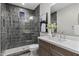 Spa-like bathroom with dark tile, walk-in shower, and modern vanity at 12347 E Gold Dust Ave, Scottsdale, AZ 85259