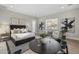 Elegant bedroom with ensuite sitting area and large windows at 12347 E Gold Dust Ave, Scottsdale, AZ 85259