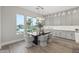 Bright breakfast nook features a modern table and chairs, with views to the backyard at 12347 E Gold Dust Ave, Scottsdale, AZ 85259