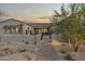 Landscaped front yard with paver walkway and desert plants leading to a modern home entrance at 12347 E Gold Dust Ave, Scottsdale, AZ 85259