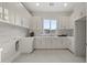 Laundry room with lots of cabinet space and sink at 12347 E Gold Dust Ave, Scottsdale, AZ 85259