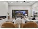 Living room with fireplace and sliding glass doors opening to backyard at 12347 E Gold Dust Ave, Scottsdale, AZ 85259