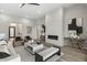 Living room with fireplace, hardwood floors, and stylish armchairs at 12347 E Gold Dust Ave, Scottsdale, AZ 85259