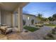 Relaxing covered patio with comfortable seating, overlooking a landscaped area at 12347 E Gold Dust Ave, Scottsdale, AZ 85259