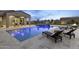 Relaxing pool with plenty of lounge chairs and fire pit at 12347 E Gold Dust Ave, Scottsdale, AZ 85259