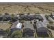 Aerial view of neighborhood with houses and solar panels at 1240 W Falls Canyon Dr, Casa Grande, AZ 85122